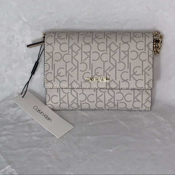 Calvin Klein Handbags - NWT Calvin Klein beige print logo crossbody